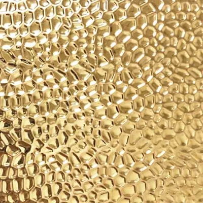 La couleur d'or a gravé le modèle en refief de nid d'abeilles de feuille d'acier inoxydable